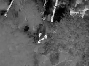 Supporting image for story: Police drone catches suspected burglar climbing out of house window