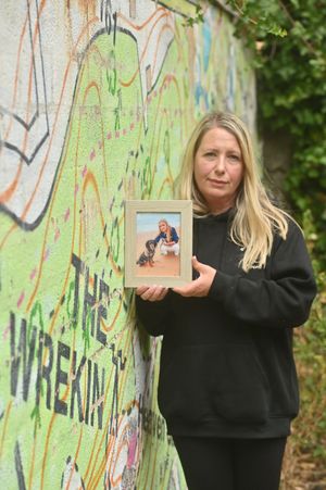 Leanne Vaughan holds up a picture of her daughter, Lily-May