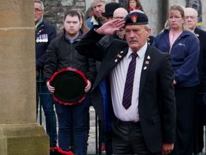 Builth Wells Royal British Legion Club member Mike Arrowsmith salutes after laying a wreath on behalf of Builth Wells Bowling Club. (Image: Andy Compton)