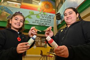 With school murals: Jasleen 10 and Leah 9.