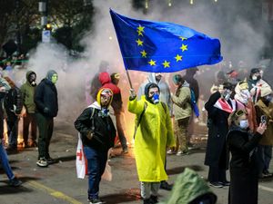 Supporting image for story: Protesters gather for third night of demonstrations over move to halt EU talks