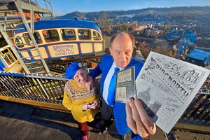 Owners Eileen Tipping and Malvern Tipping with a reproduction of a pamphlet from when the cliff railway opened in 1892