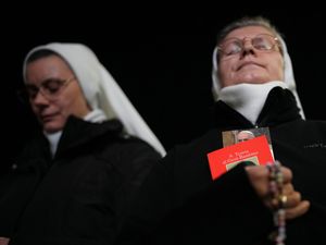 Nuns pray for the Pope