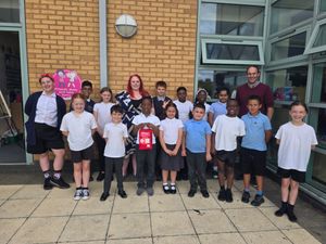 Emily with children and staff at Wren’s Nest Primary School, Dudley with an ‘original’ The Daniel Baird Foundation bleed control kit 