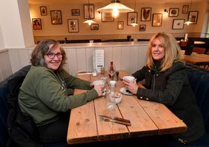 Nicola Withers and Val Gant enjoy a drink and a chat