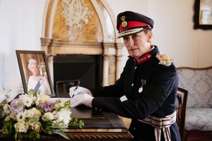 Anna Turner signs the book of condolence at Shrewsbury Castle