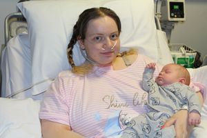 Ellie Wright pictured when she was able to hold her baby boy, Leo, for the first time
