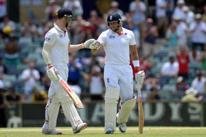 England's Ben Stokes (left) and Tim Bresnan (right) congratulate one another