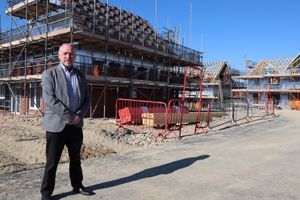 John Green, chief executive of Shropshire Rural Housing Association, next to a housing development in Chirbury that is set to be completed in September. Picture: JandPR