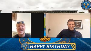 Town boss Sam Ricketts speaks to fan Lewis Smith