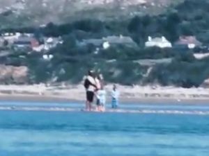 Supporting image for story: Family stranded on sandbank rescued with 'seconds' to spare