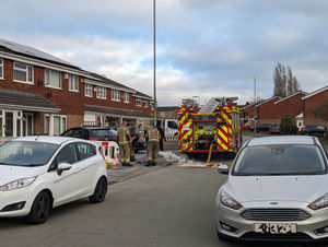 Firefighters at the scene of the car blaze in Willenhall