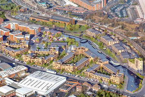 This artist's impression shows the new homes lining the canal with Albion Street visible at the bottom of the picture and the railway line with the low level station at the top