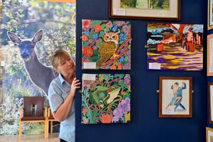 The Great Wyrley Art group have an exhibition on at Chasewater Innovation Centre
Chasewater Cafe staff member Carol Woolley, looks at and enjoys work by Barbara Gibbs.
