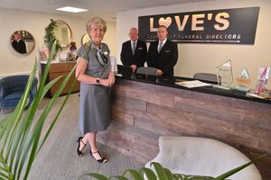 Stuart, right, with his parents Susan and Terry Love