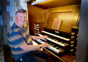 Tim Lees with the organ at St John's Church in Dudley