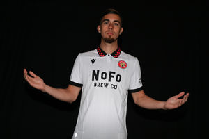 Walsall captain Taylor Allen in the white kit with red and black check collar (Picture: Walsall FC)