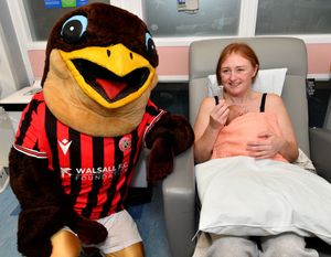 Walsall FC players visit Walsall Manor Hospital.Swifty with Billie Taylor and baby Reeva Wright.