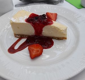 Vanilla Baked Cheesecake and berry compote with fresh cream