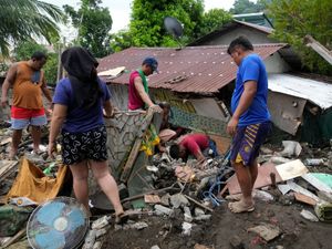 Supporting image for story: Toll of dead and missing passes 100 following Tropical Storm Trami