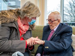 Supporting image for story: Veteran delighted to hold hands with his daughter once more at care home