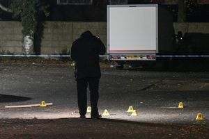 A police photographer takes pictures of evidence. Photo: SnapperSK