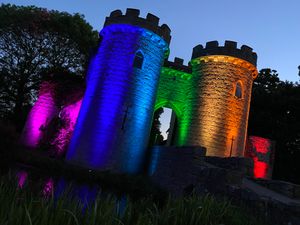 Supporting image for story: At-risk Whittington Castle lit up in rainbow spectacle
