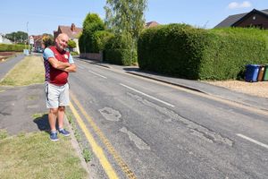 Roger Wain standing near tar that has melted in heatwave on Gorsemoor Road in Cannock. Gorsemoor Road in Cannoc in Staffordshire is melting down in the heatwave. The highways authority has temporarily closed the road, and has been out on Saturday to treat it .