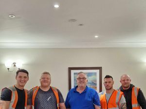 Supporting image for story: Scaffolders hit the right note as they help move piano to complete care home's pub