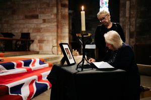 Sisters Shirley Ruscoe and Susan Smithson sign the book of condolence at Shrewsbury Abbey