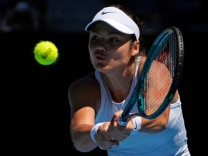 Emma Raducanu hits a backhand at the Australian Open