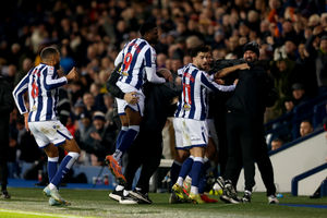 Jayson Molumby and Albion players and staff embrace after the winner. (Photo by Adam Fradgley/West Bromwich Albion FC via Getty Images)