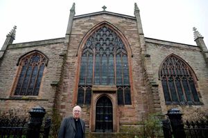 The Venerable Colin Williams outside S. Laurence's Church in Ludlow