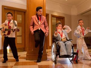 Supporting image for story: Lookalikes slip on their blue suede shoes and head to Elvis convention