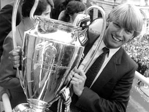 May 1982 Birmingham Council House. Civic reception for Aston Villa FC after winning the European Cup. Gary Shaw poses with the cup on the balcony in front of a gathering of fans.
