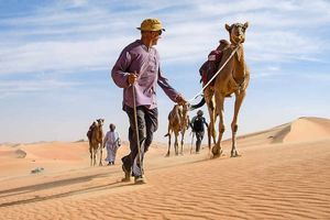Mark Evans, front, leading his expedition through the desert