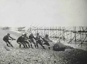 This photograph shows a bomb being pulled out of the sea
