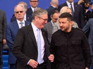 Prime Minister Sir Keir Starmer and Ukraine President Volodymyr Zelensky speak during the family photo at the European Political Community Summit in Tirana, Albania