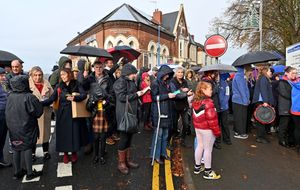 People gather in the road, which was closed off for the unveiling. Photo: Tim Thursfield