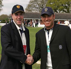 Shane Warne and Guy Home shake hands prior to the game at Whitchurch against Shropshire