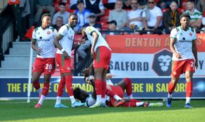 Walsall players celebrate Rollin Menayese's opener