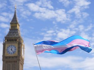 Campaigners take part in a rally organised by trans rights groups