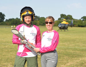 Matt Linghan from RAF Shawbury hands the baton over it over to Diane Morgan, from Shrewsbury 