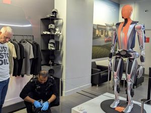 Supporting image for story: Just Stop Oil protesters guilty after latex poured on Tesla robot