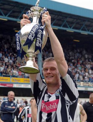 Lifting the Championship trophy in 2008.