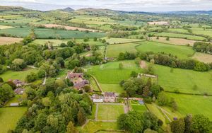 Aerial view of Acton Scott Hall, looking north east towards the Stretton Hills.