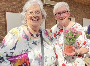Janis Lomas with Chrissy Whereat as gleeful winners of Chairman’s Cheer and Paul’s Present  