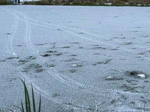 Supporting image for story: Shocking image shows bike tracks across frozen pool in Telford despite warnings