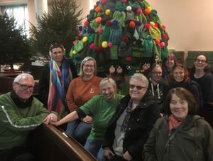 Supporting image for story: Yarn bombers knit hats for a tree with a difference for Christmas Tree Festival
