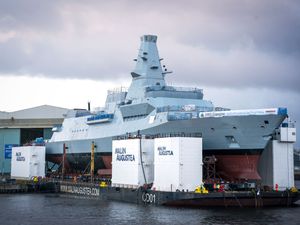Supporting image for story: Kate names Royal Navy warship by smashing bottle of whisky against hull